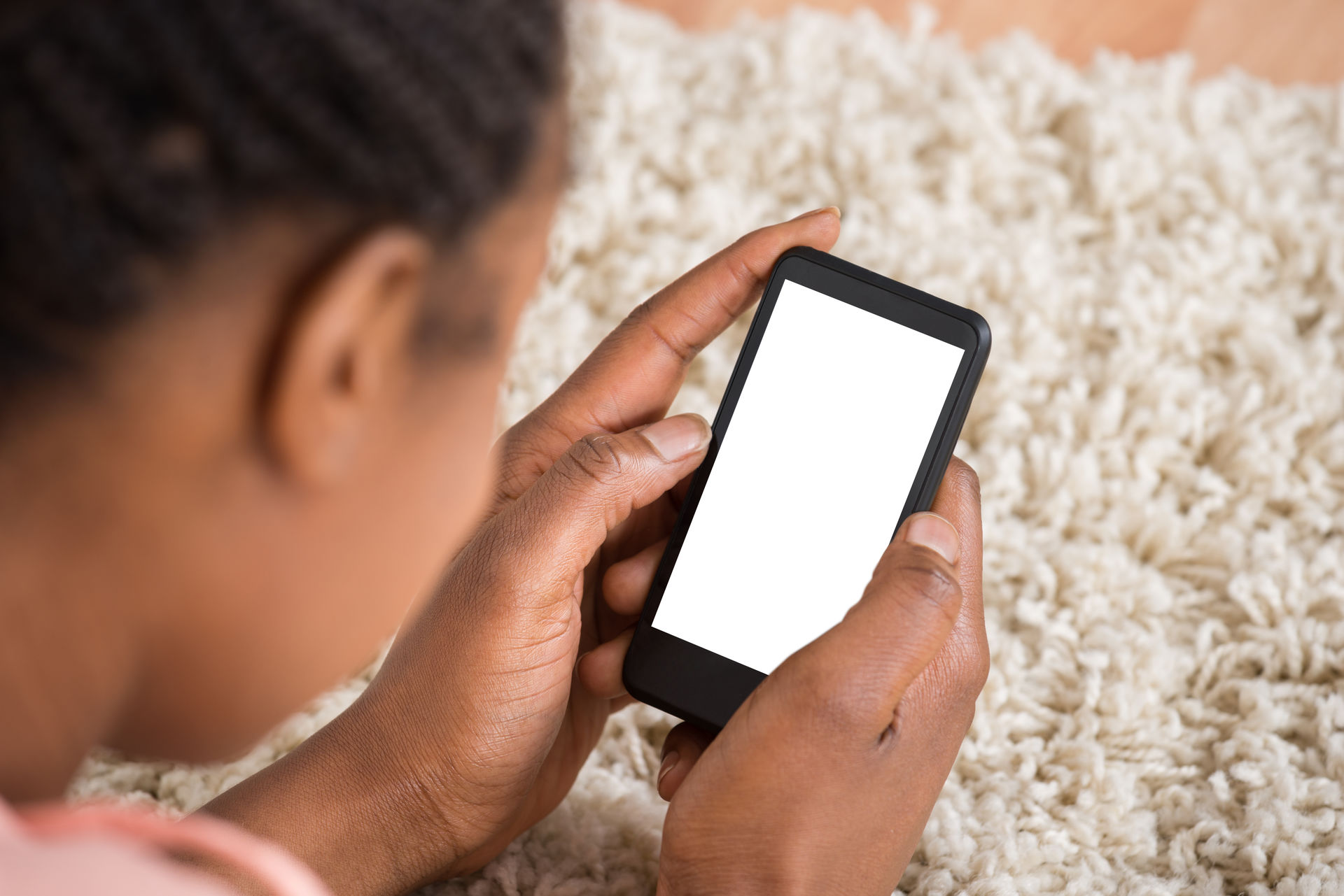 young person holding a phone